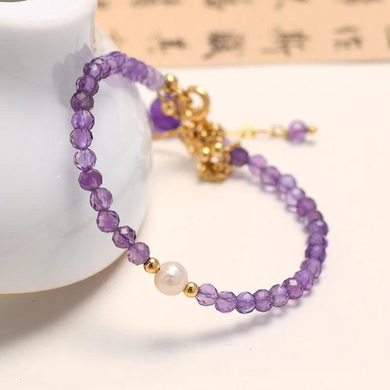 Chinese style amethyst coloured crystal bracelet for women with electroplated diamond shapes.
