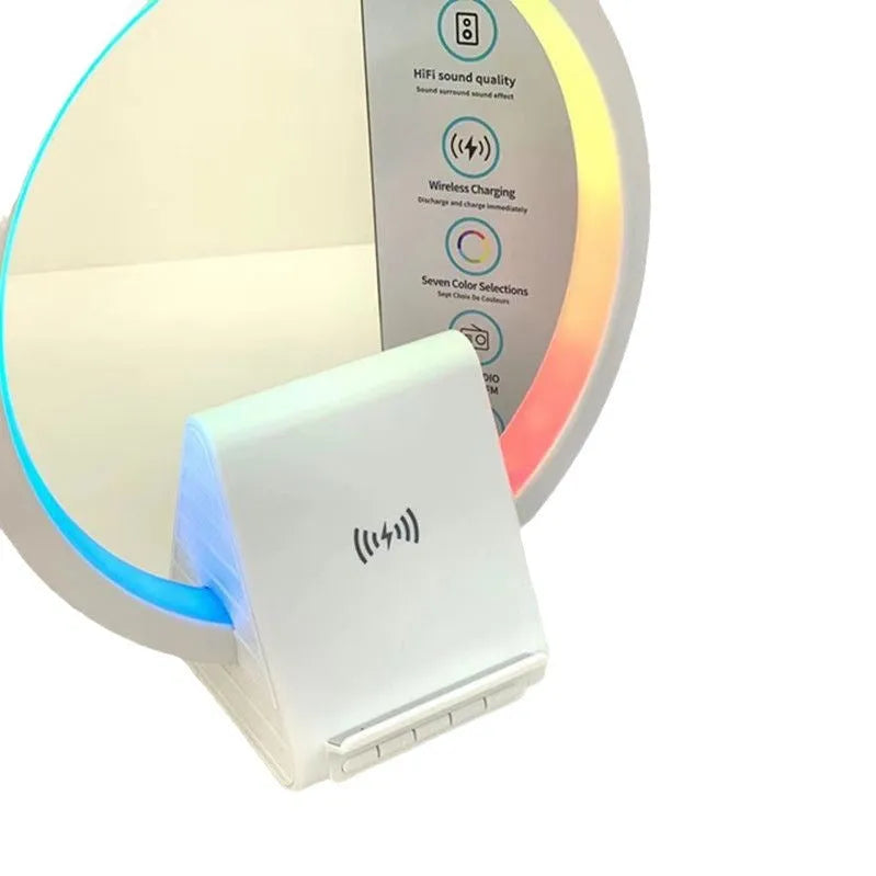 White smart Bluetooth speaker with wireless charging pad and ambient lighting on desktop