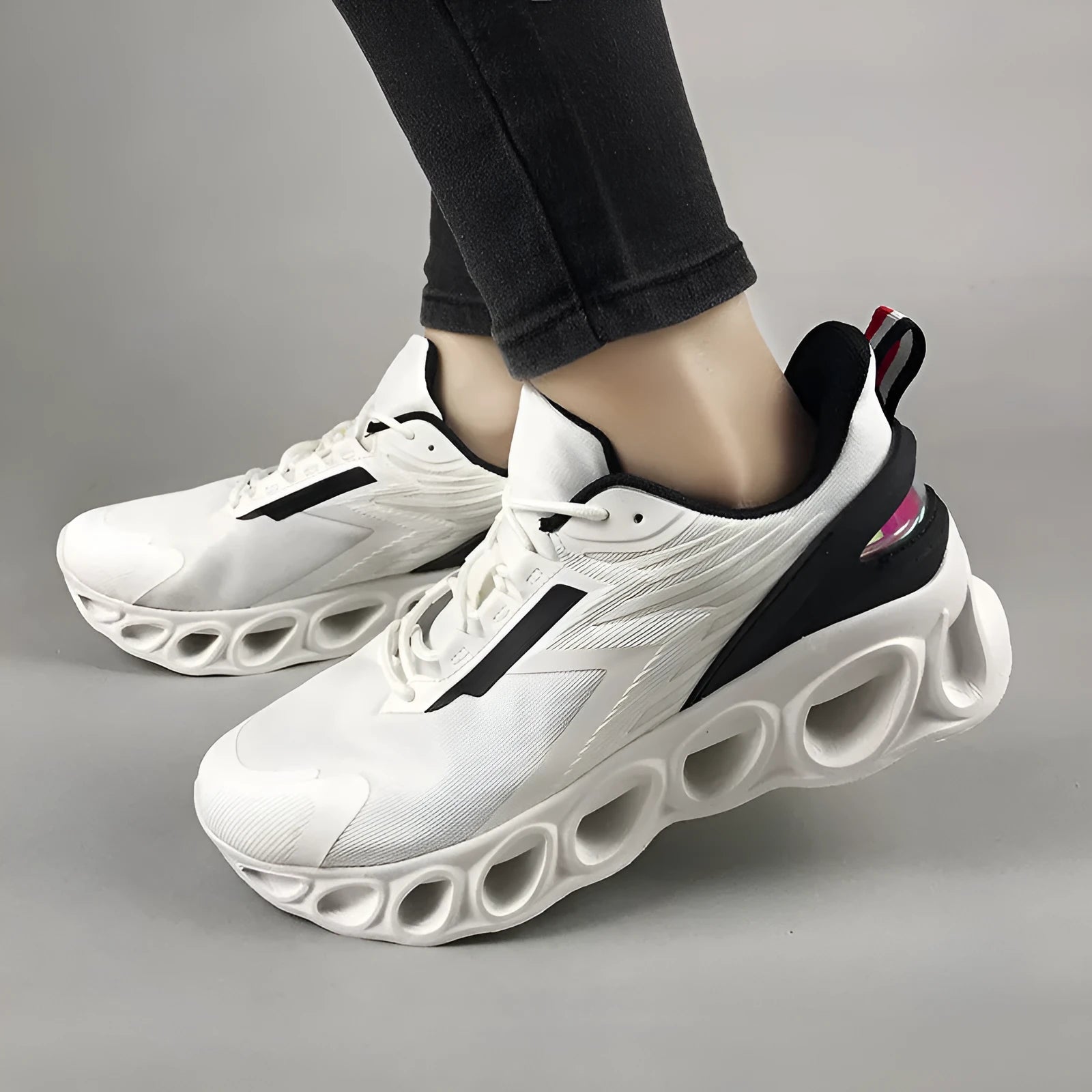 A pair of men's low-top casual trainers in a choice of colours, featuring a mesh upper and lace-up front.