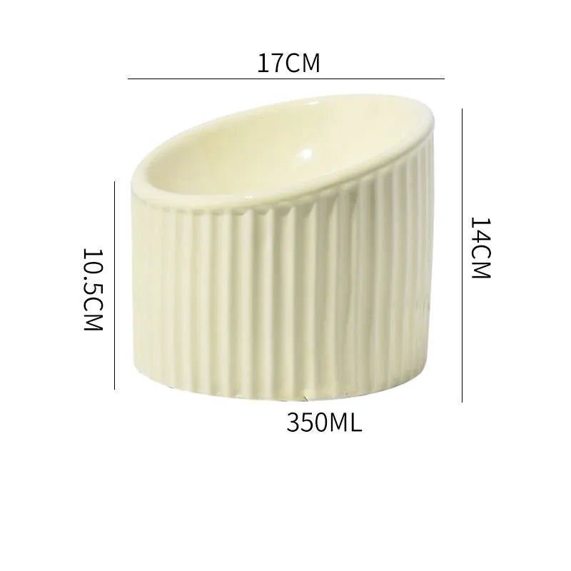 Ceramic elevated cat bowl in round tilted design with raised height for indoor cats