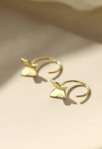Pair of 925 silver butterfly stud earrings, 13x6mm, golden colour finish on grey background