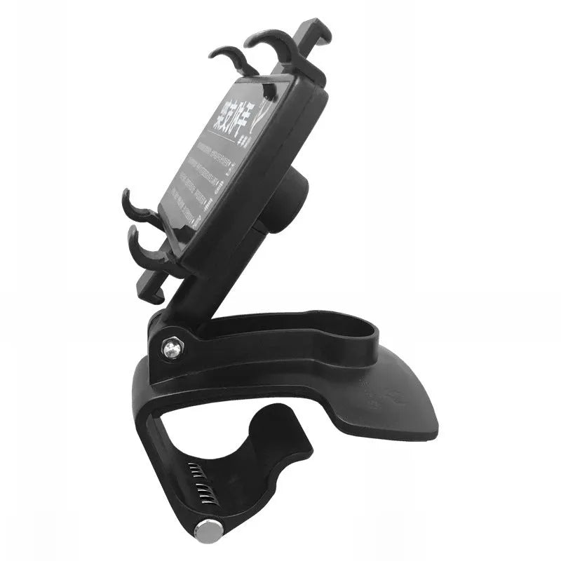 Black car phone holder mounted on dashboard with smartphone in clip