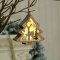 Set of four laser-cut wood Christmas decorations with polychromatic colouring: tree-shaped old man, snowman, deer, and five-star snowman on a festive table