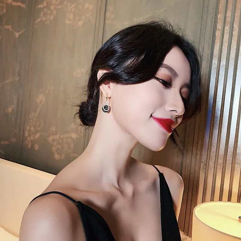 Black retro Hong Kong style geometric round earrings measuring 3.6cm length with alloy construction