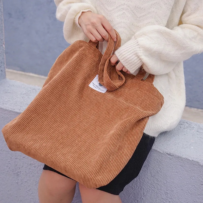 Women's corduroy shoulder bag in medium square vertical shape with soft handle, open top, available in black
