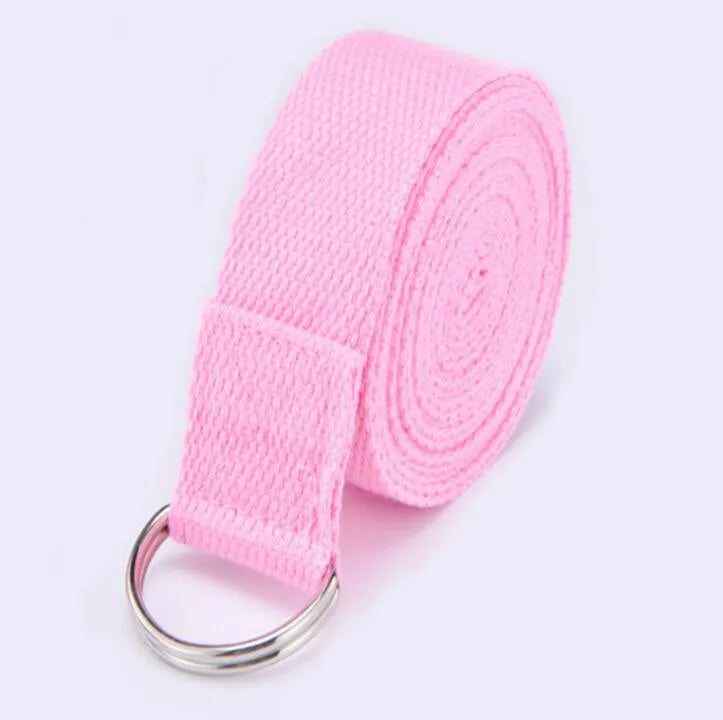 Pure colour EVA yoga brick, thick non-slip mat, and cotton tension band on a floor, in blue, purple, pink, red, black, gray