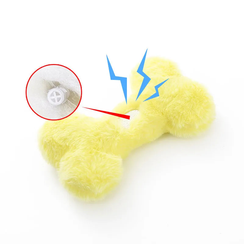 Blue Love Bone shaped plush dog toy with a squeaker on a white background.