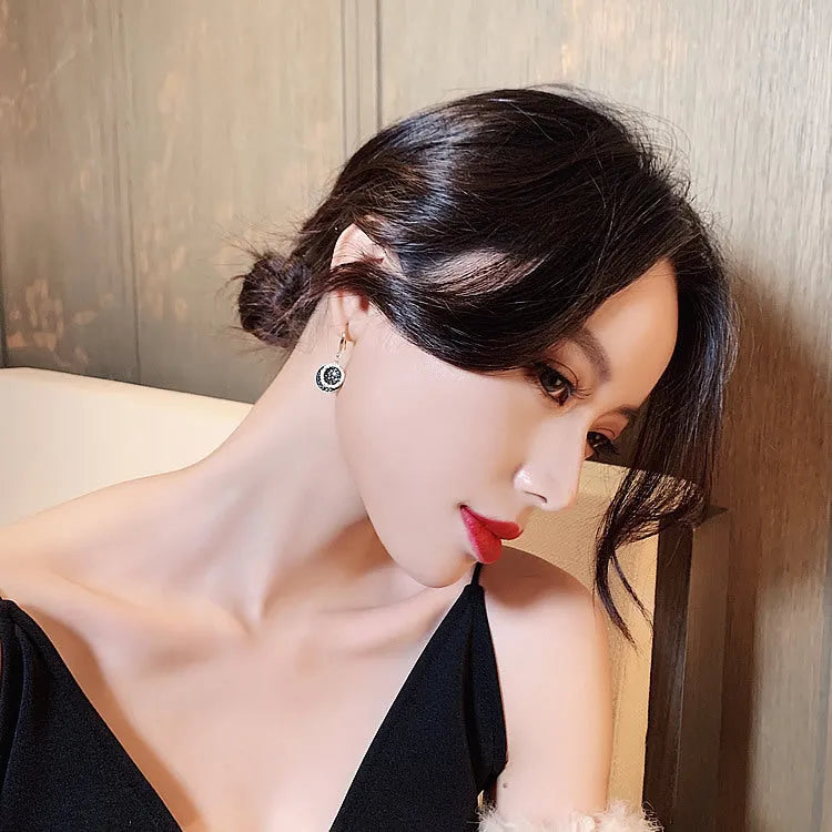 Black retro Hong Kong style geometric round earrings measuring 3.6cm length with alloy construction