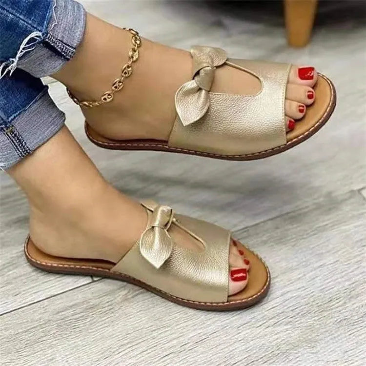 Ladies casual sandals with bow detail and fish mouth style in black, pink, and gold colours