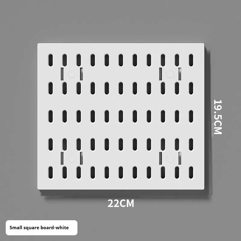 White plastic punch-free wire-wrap board organising cables on wall with modular panel design