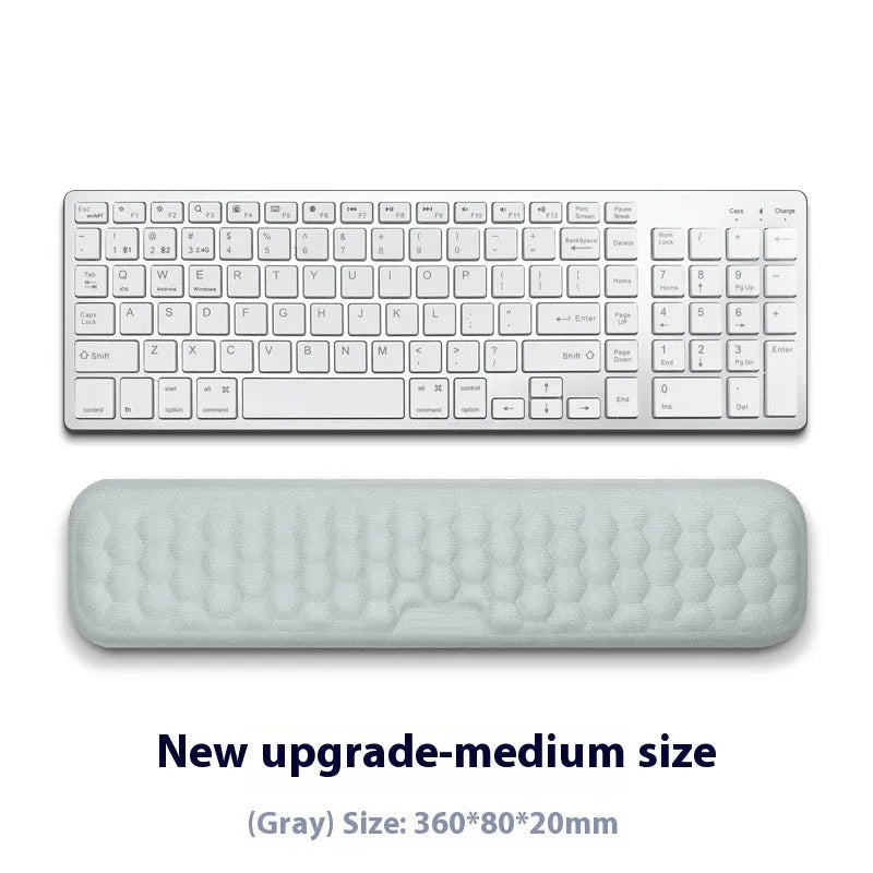 Memory foam mouse wrist rest with silicone base in black cloth and grey leather style options.