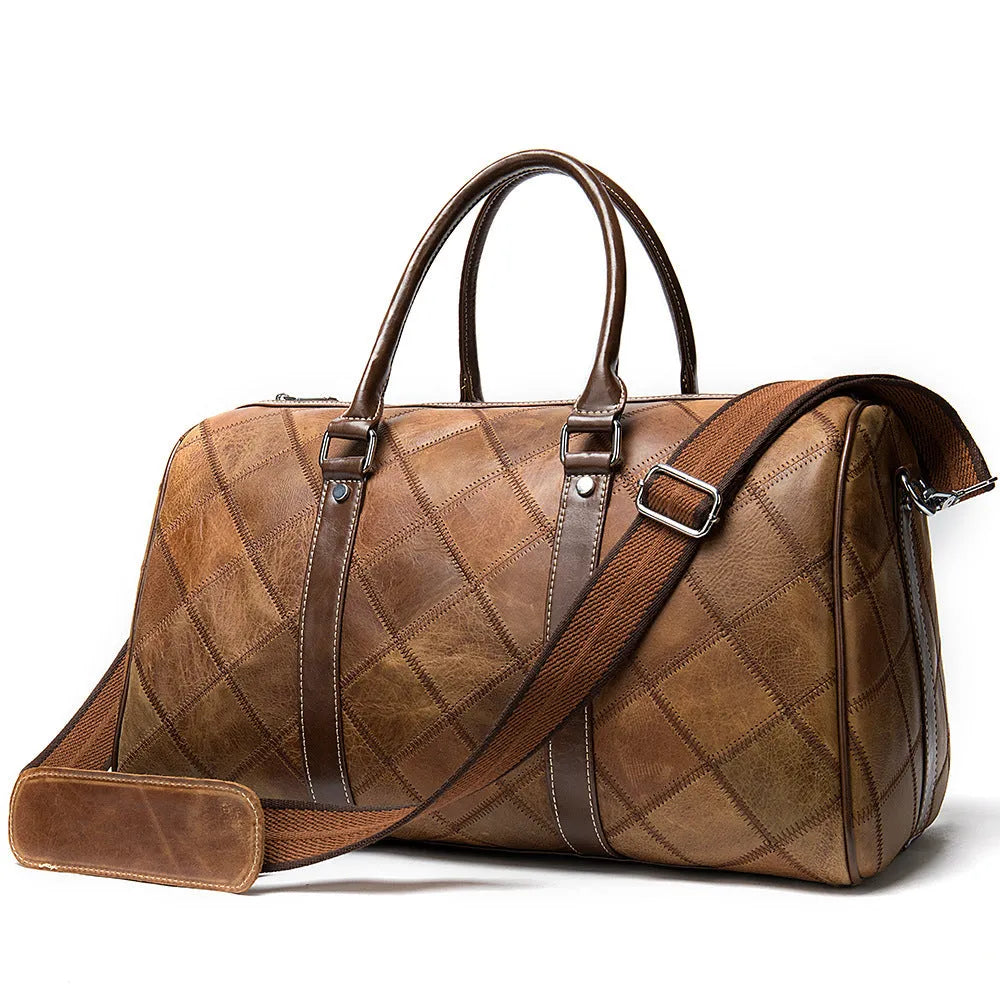 Men's vintage leather duffel bag in black showing internal phone and ID pockets.