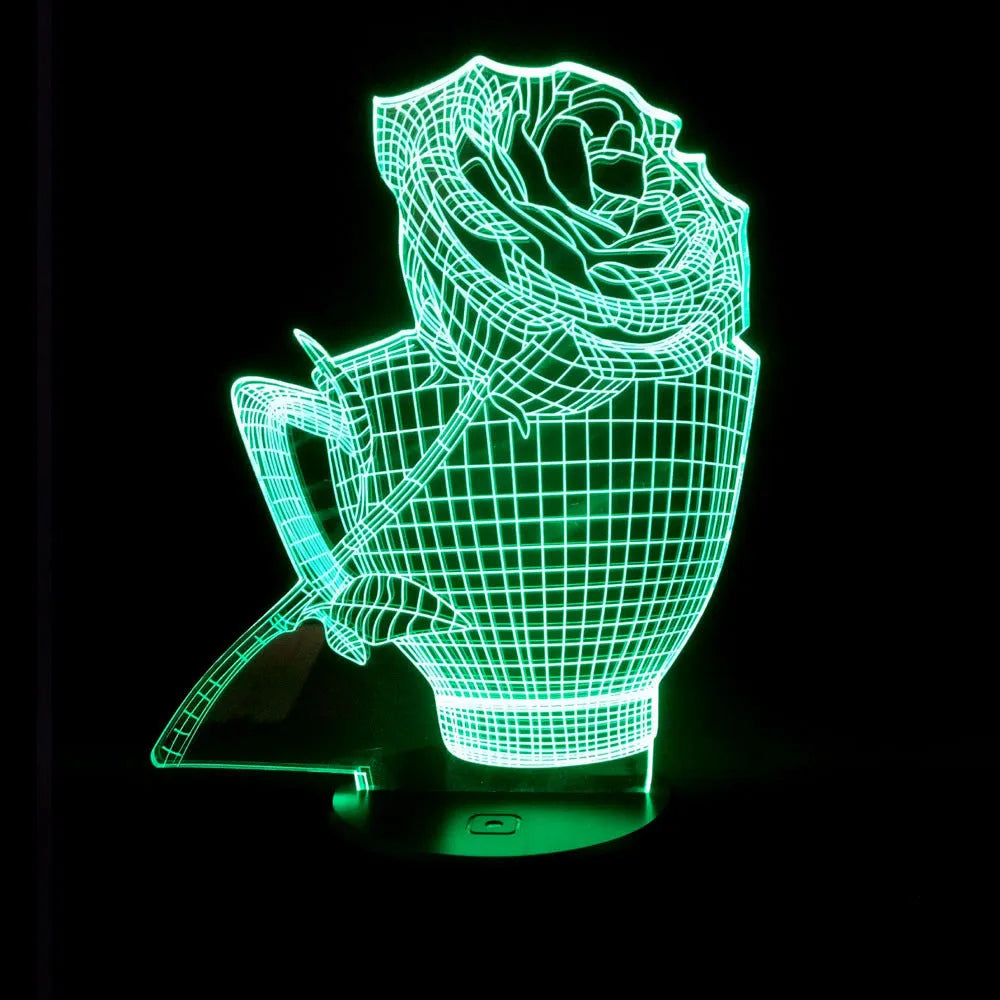 3D acrylic rose flower night light in black finish on a table, showing multicoloured LED illumination.