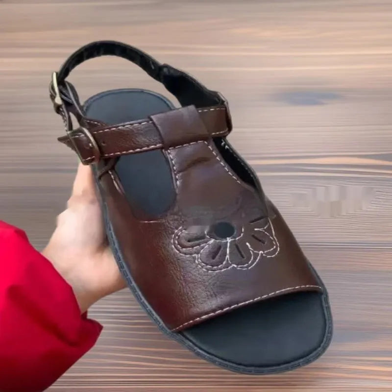 Men's black embroidered flower pattern beach sandals with flat heel and PU upper material.