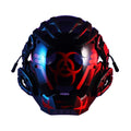 Black full-face cybernetic prop helmet with sci-fi design on a model or stand.