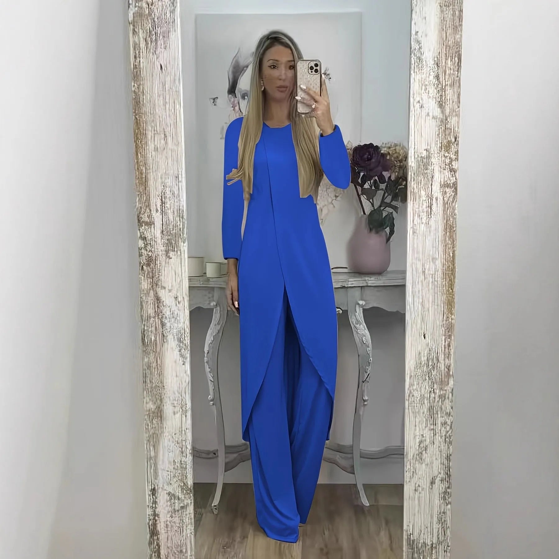 Casual black polyester two-piece lounge set with long sleeve top and loose trousers on a hanger.