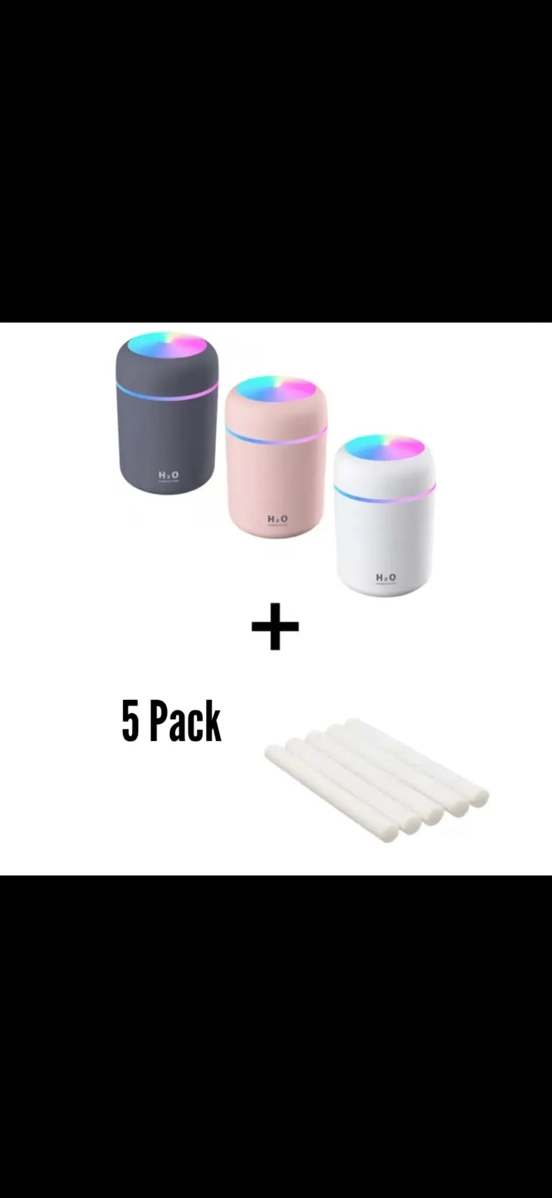 Pink USB desktop humidifier with colourful LED lights and 300ml water tank on wooden desk