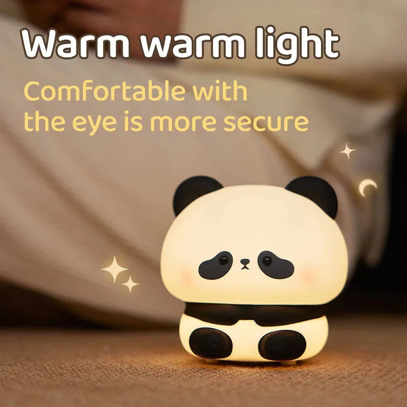 Panda LED night light with soft silicone head and colourful glow on a wooden table