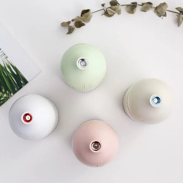 White USB aromatherapy diffuser humidifier with 300ml capacity and LED light on wooden table