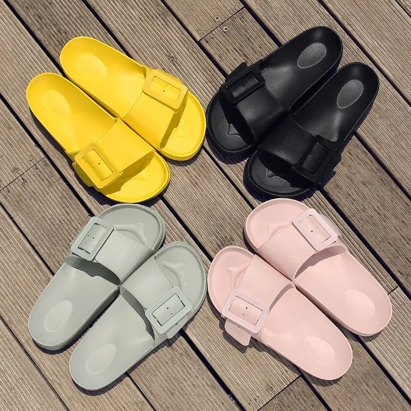 Women's grey blue EVA buckle slippers showing buckle detail and textured sole