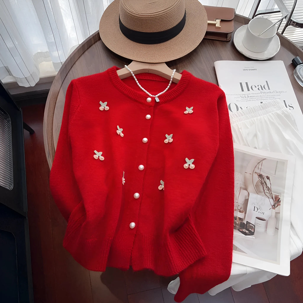 Women's cashmere cardigan with beaded detailing in pink colour showing round neck and slim fit