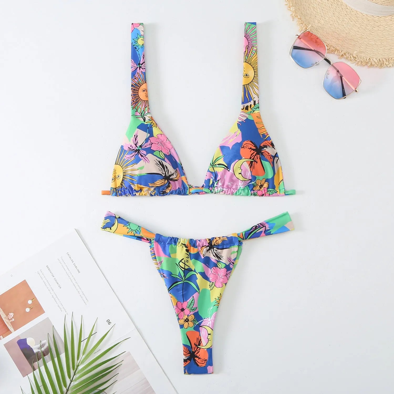 Women's floral print bikini swimsuit in blue, rose red, sky blue, or white colour.