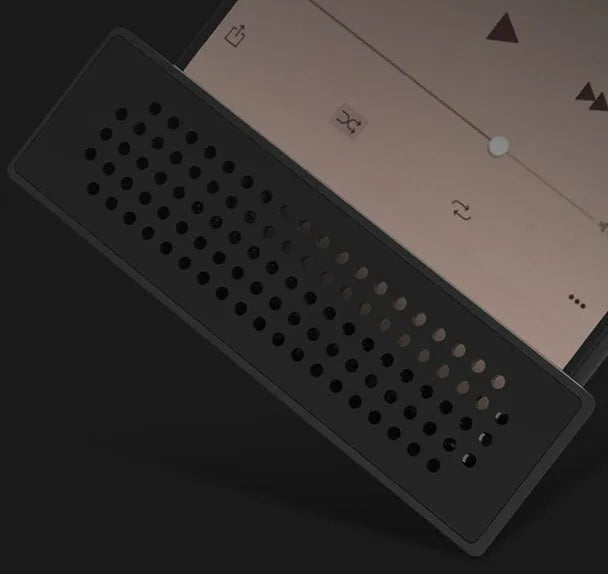 Portable black ABS mobile phone amplifier bracket holding an iPhone on a desk.