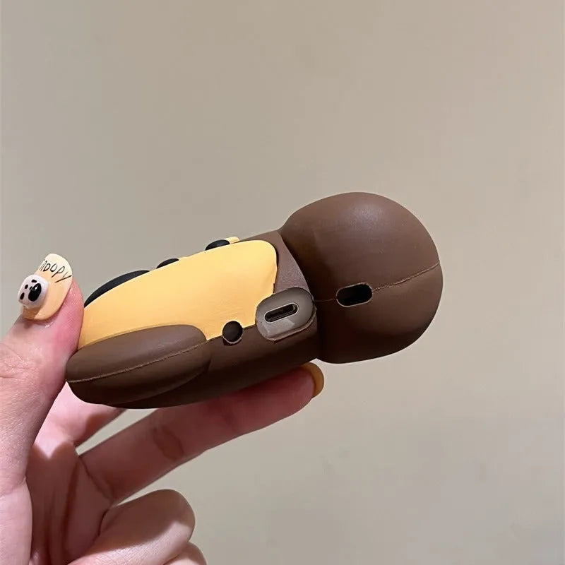 Brown puppy silicone earphone case on AirPods charging case with embossed cartoon design