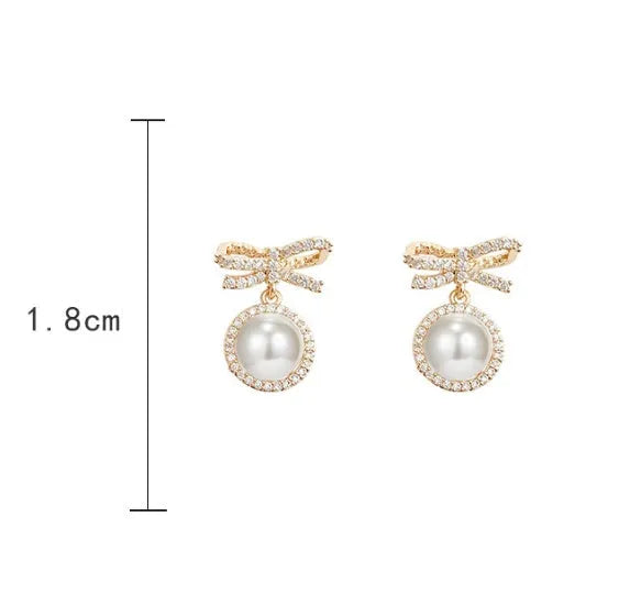 Bow pearl simple micro stud earrings in white with copper electroplated finish and white gold inlaid gemstone