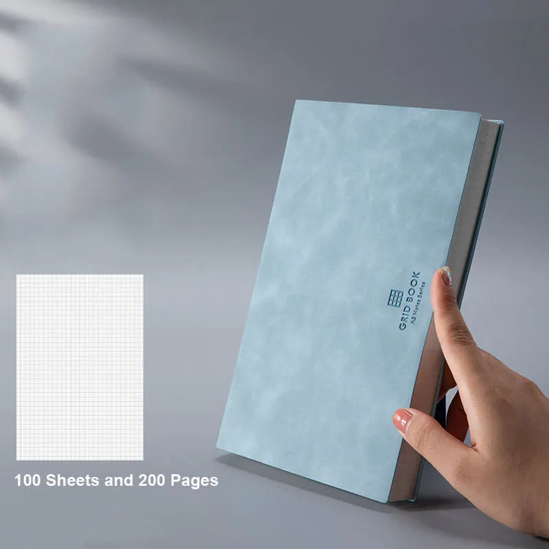 Grid book with hand-painted square grid, PU cover in lake blue, locking plastic binding, A5 size