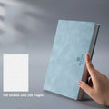 Grid book with hand-painted square grid, PU cover in lake blue, locking plastic binding, A5 size