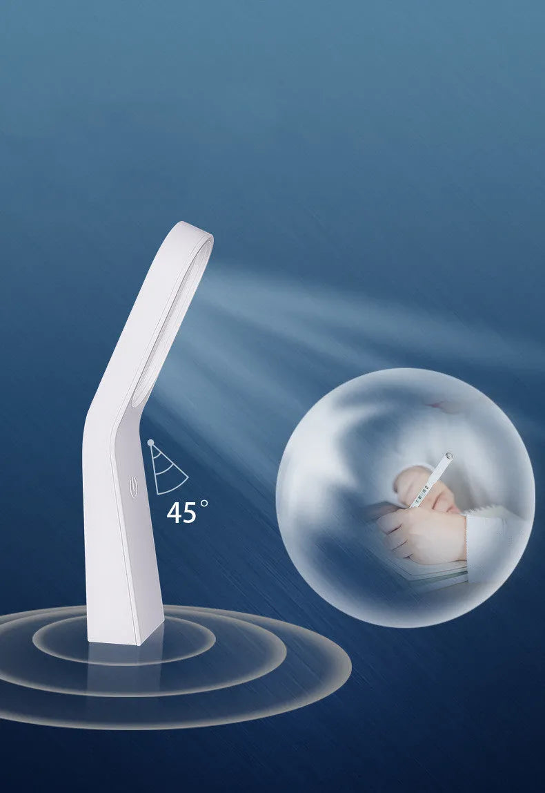 Simple white LED desk lamp with touch control and USB cable on a modern desk