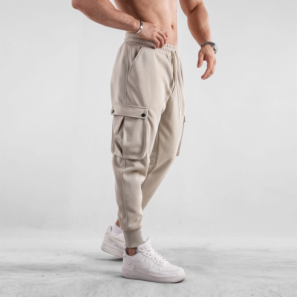 Men's cotton sports trousers with ankle ties and multiple pockets in apricot colour