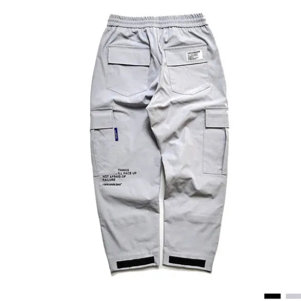 VantageGo black cotton streetwear joggers with elasticated waist, side view on model