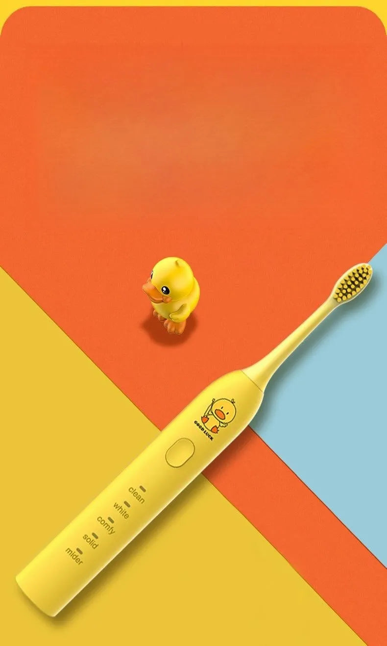 Small Yellow Duck rechargeable electric toothbrush in yellow, showing soft bristle head and USB port.