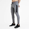 Men's cotton blended fitness running training pants in black yellow colour, slim fit with stretch waist