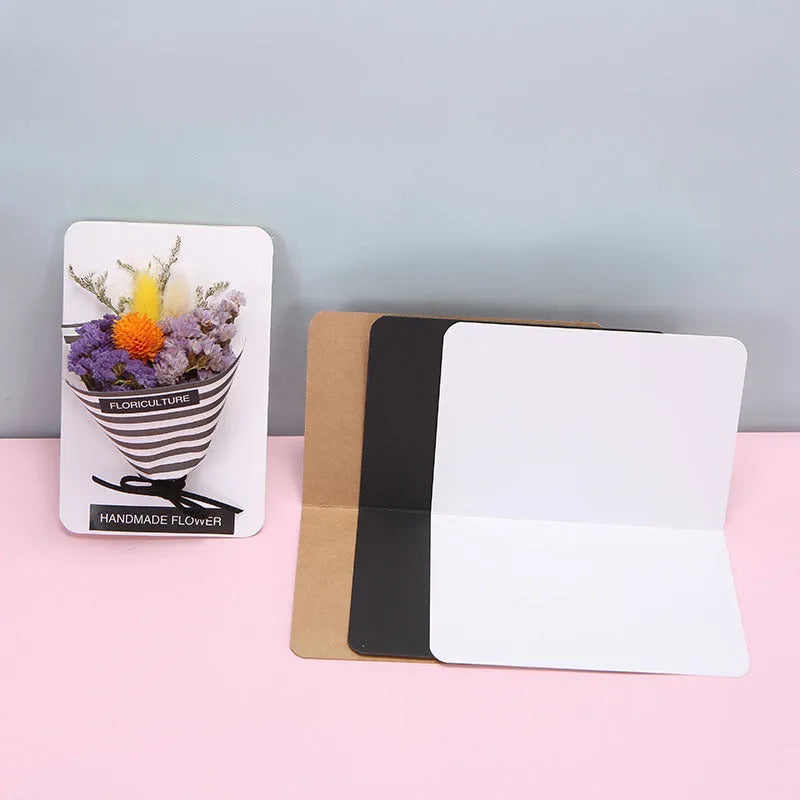 Blank folded kraft card 10x15cm in cowhide colour, packed in a stack of 100 for stationery use