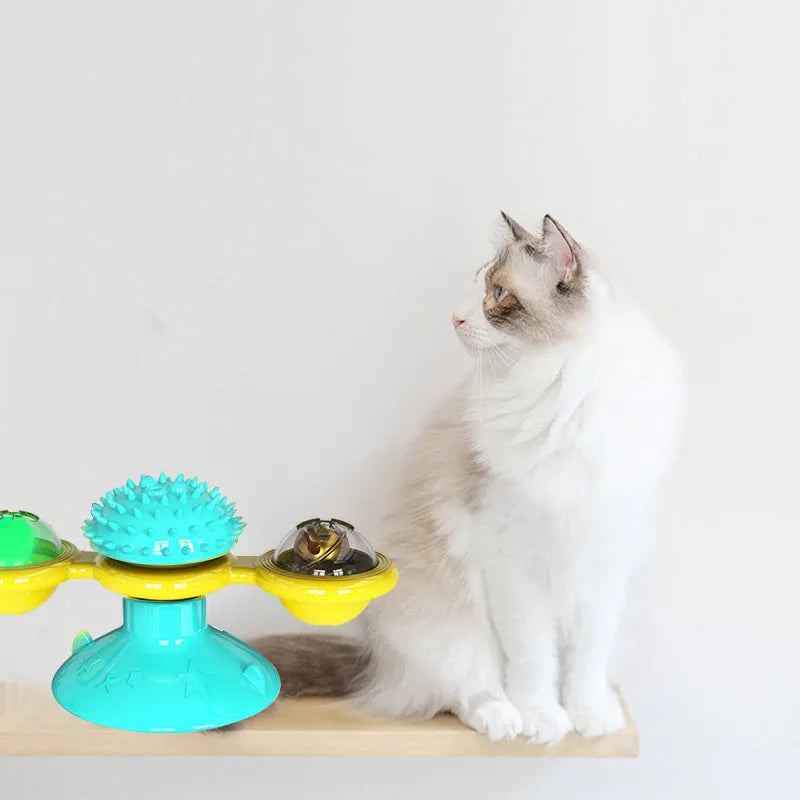 Cat rotating windmill toy with suction base on floor, two transparent bins, luminous ball, teeth grinding function, blue yellow green colour
