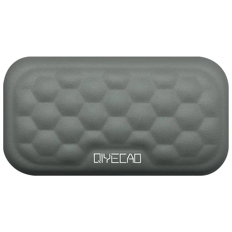 Memory foam mouse wrist rest with silicone base in black cloth and grey leather style options.