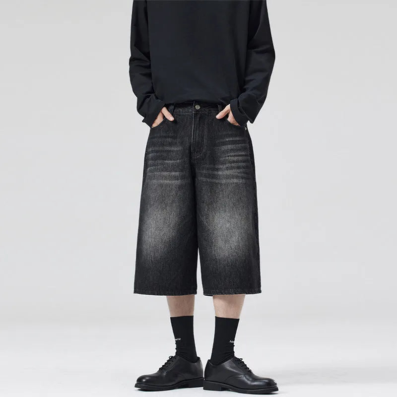 Men's loose straight-leg denim shorts in light blue colour showing cropped length and casual styling
