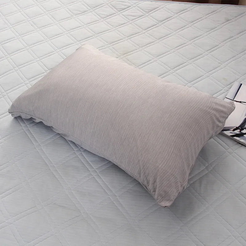 A blue polyester cooling blanket with Q-Max 0.4 technology laid on a bed.