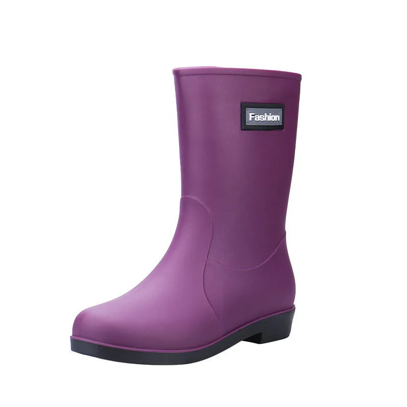 Women's mid-calf PVC rain boots in black with low heel design