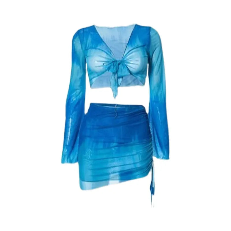 Women's blue four-piece bikini swimsuit set with high-waisted briefs, shirt, and skirt laid flat.