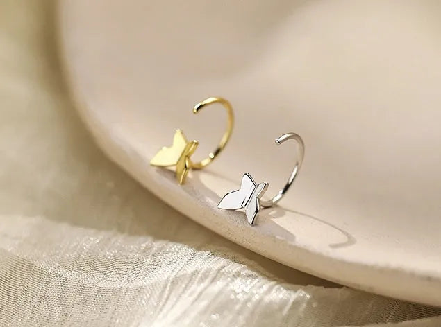 Pair of 925 silver butterfly stud earrings, 13x6mm, golden colour finish on grey background