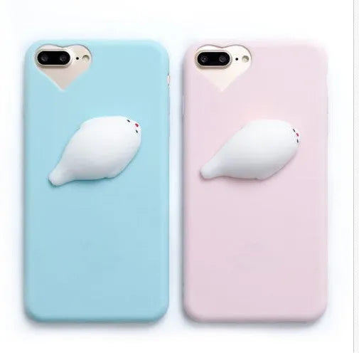 Soft silicone iPhone case with a raised 3D cartoon cat design in pink.
