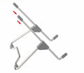 Grey aluminium alloy and plastic mobile phone and laptop stand combo on desk