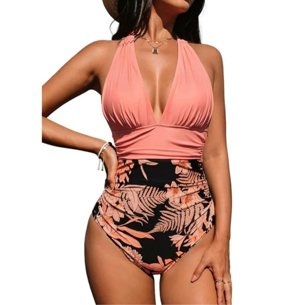 Women's backless halter neck one-piece swimsuit in quick-dry polyester, shown in a floral print