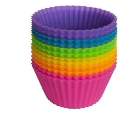 12 nonstick reusable silicone cupcake liners in six colours arranged for baking