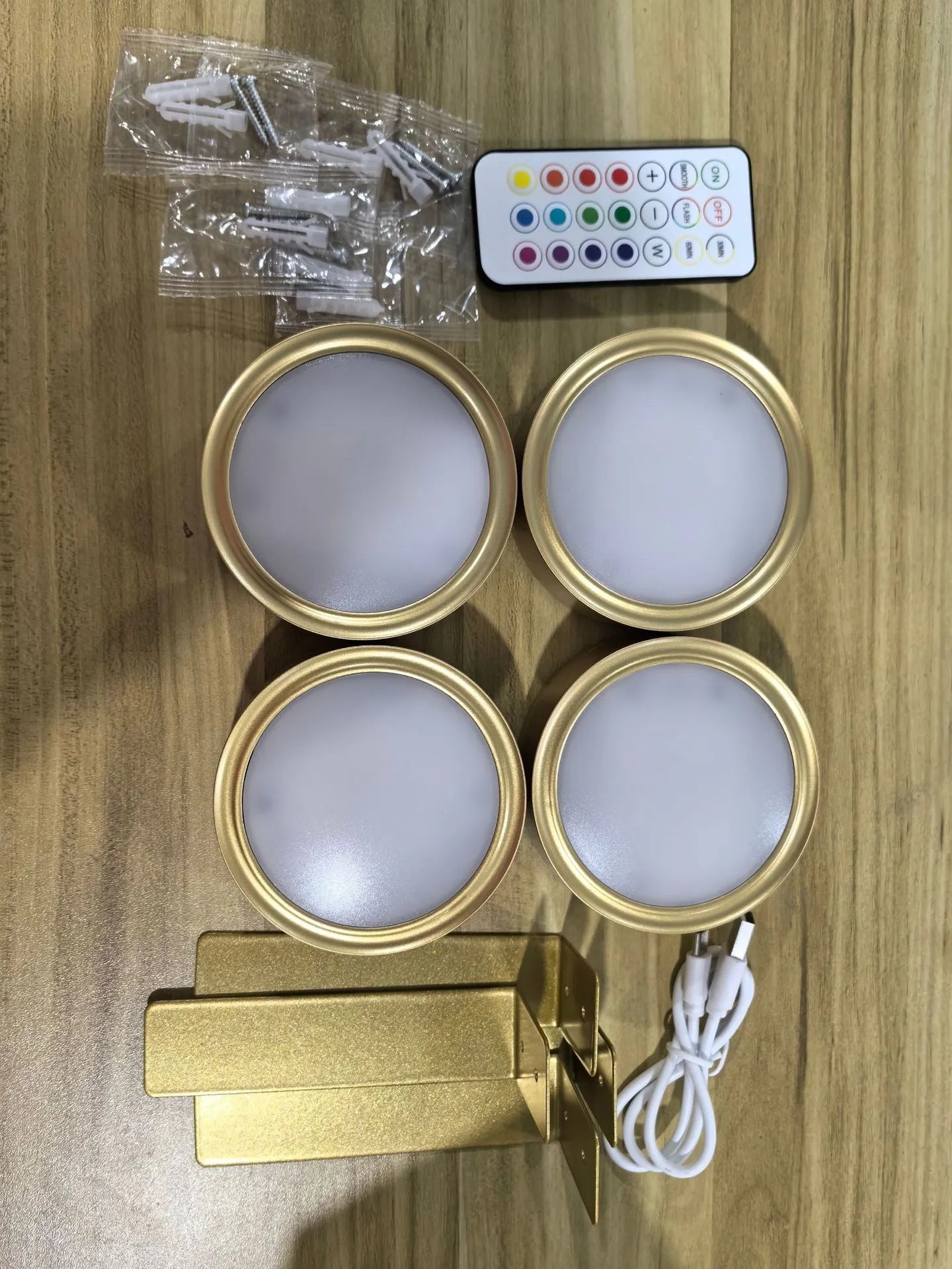 Wireless LED painting lamp with a magnetic mounting belt and remote control in black finish.