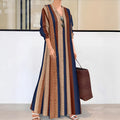 Camel coloured knitted dress with vertical stripes, V-neck collar and long sleeves